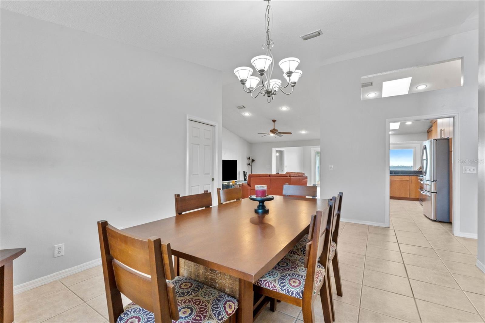 Open and airy dining room with clear views into the family room and kitchen, ideal for seamless entertaining and family gatherings.