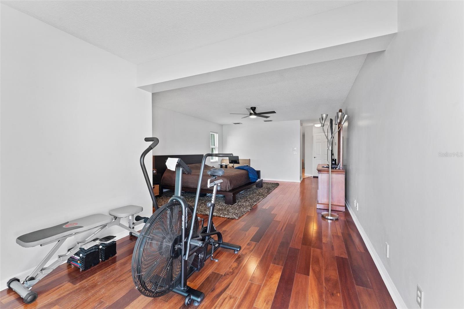 Versatile bonus space in the primary bedroom, perfect for a reading nook, workout area, or personalized retreat.
