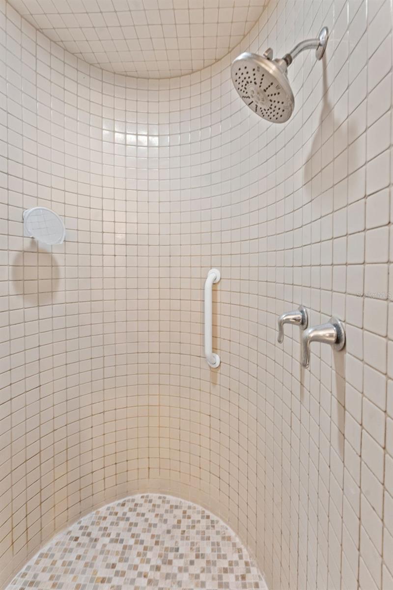 Experience spa-like luxury in the primary bathroom’s large walk-in shower, designed for comfort and style.
