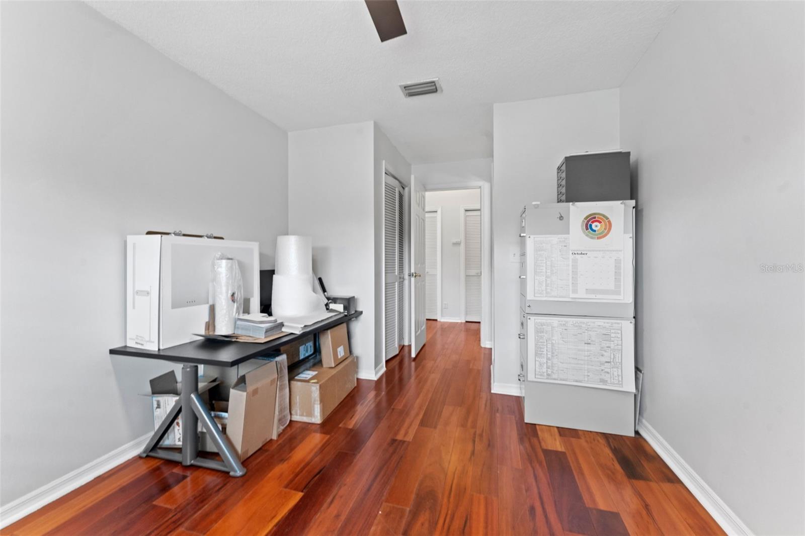 Bedroom 2 with a built-in closet and attached half bathroom, providing convenience and privacy