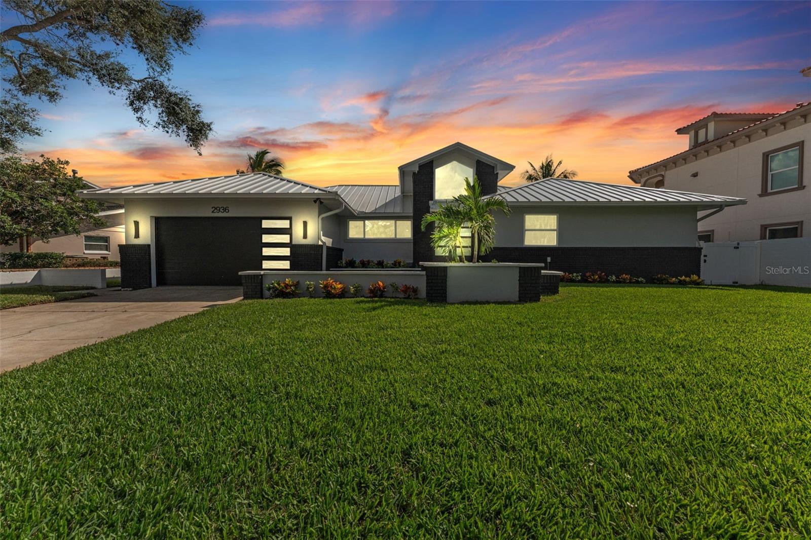 Front elevation of the home at twilight, showcasing its curb appeal and inviting ambiance.