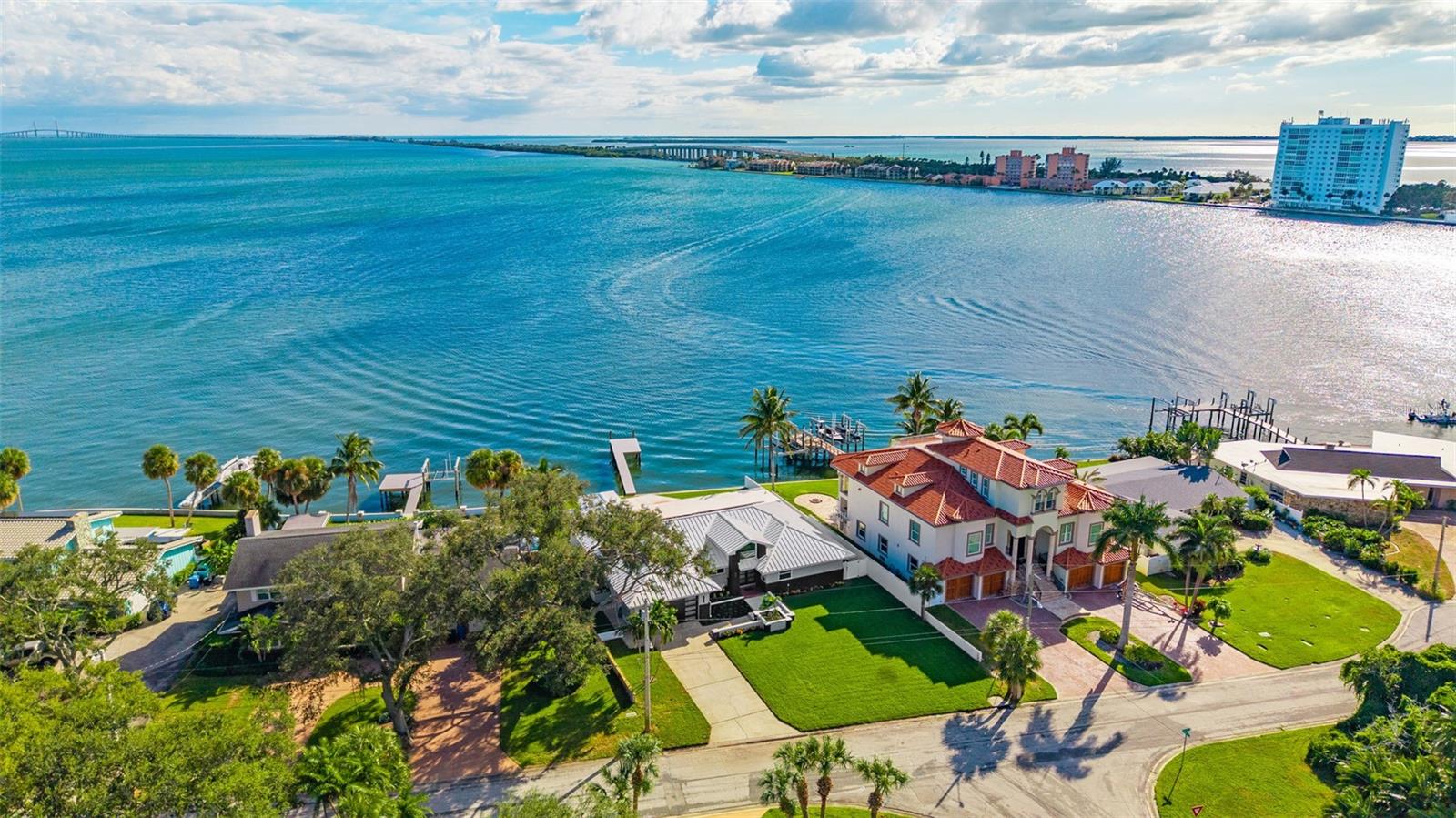 Drone shot capturing the stunning property and breathtaking water views, highlighting the home’s prime location.