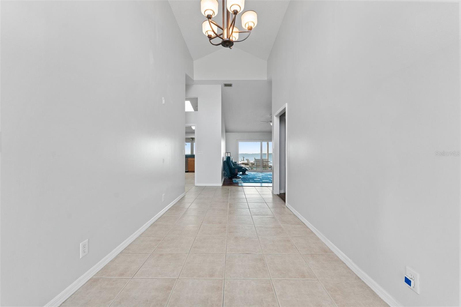 Grand foyer with soaring vaulted ceilings, setting the tone for the spacious and elegant design throughout the home.
