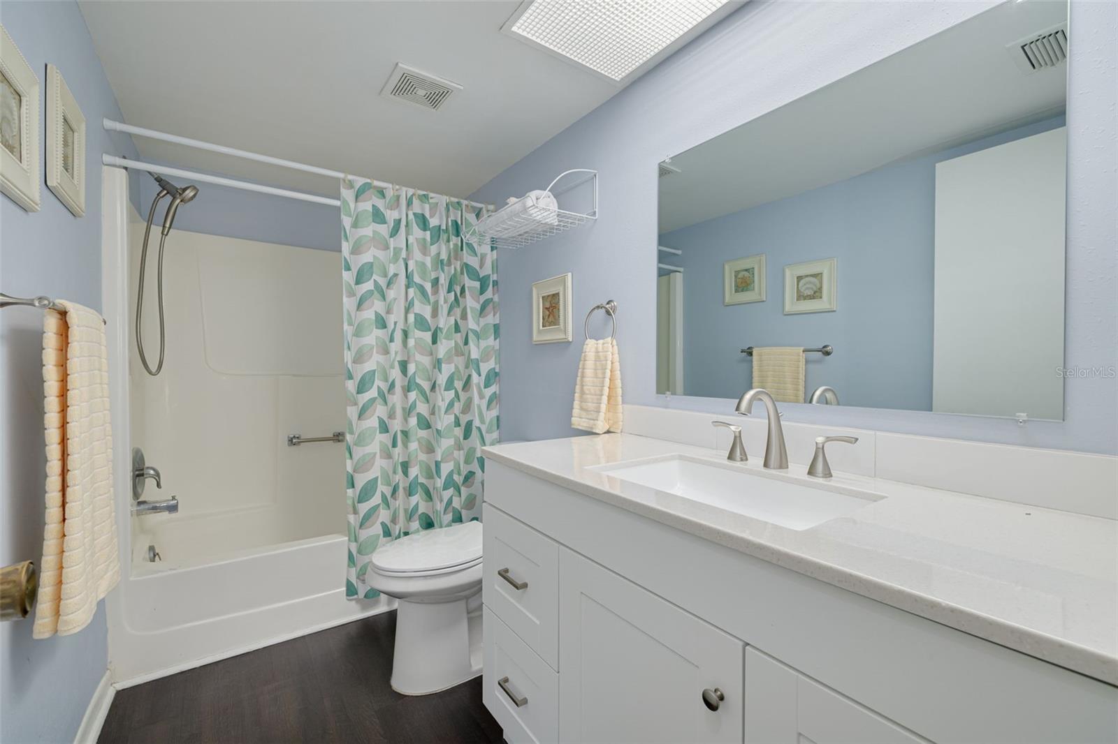 Hall bathroom with tub and shower, outside of bedrooms 2 and 3