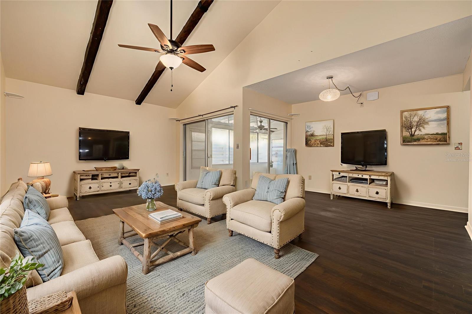 Virtually Staged Living Room with sliders to enclosed lanai