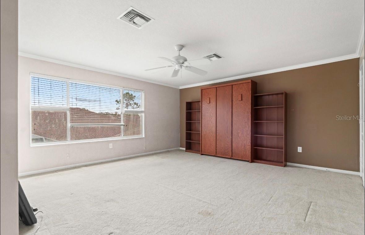 Bonus room with Murphy bed and bookshelves