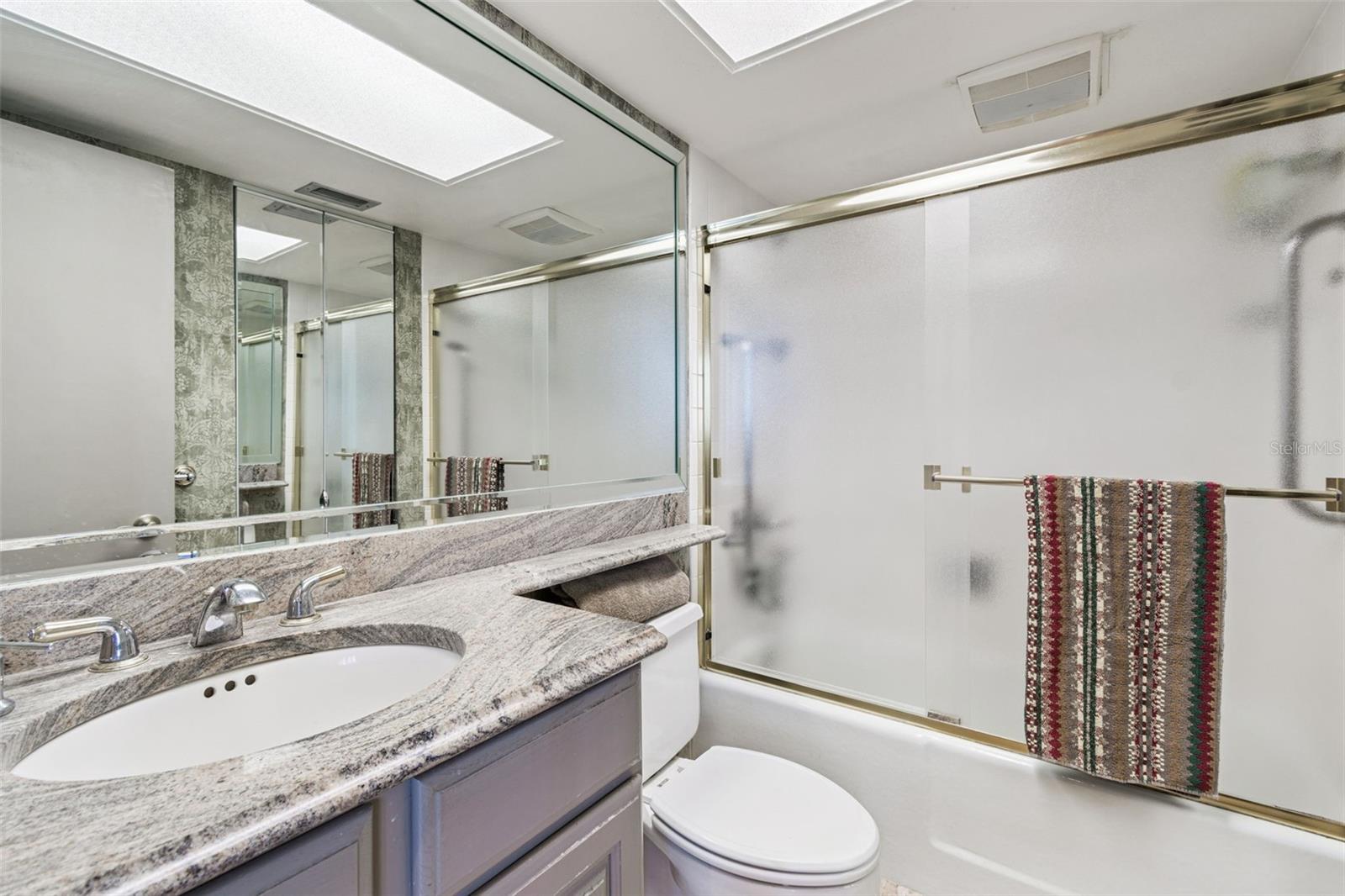 Ensuite Bathroom with Tub and Shower