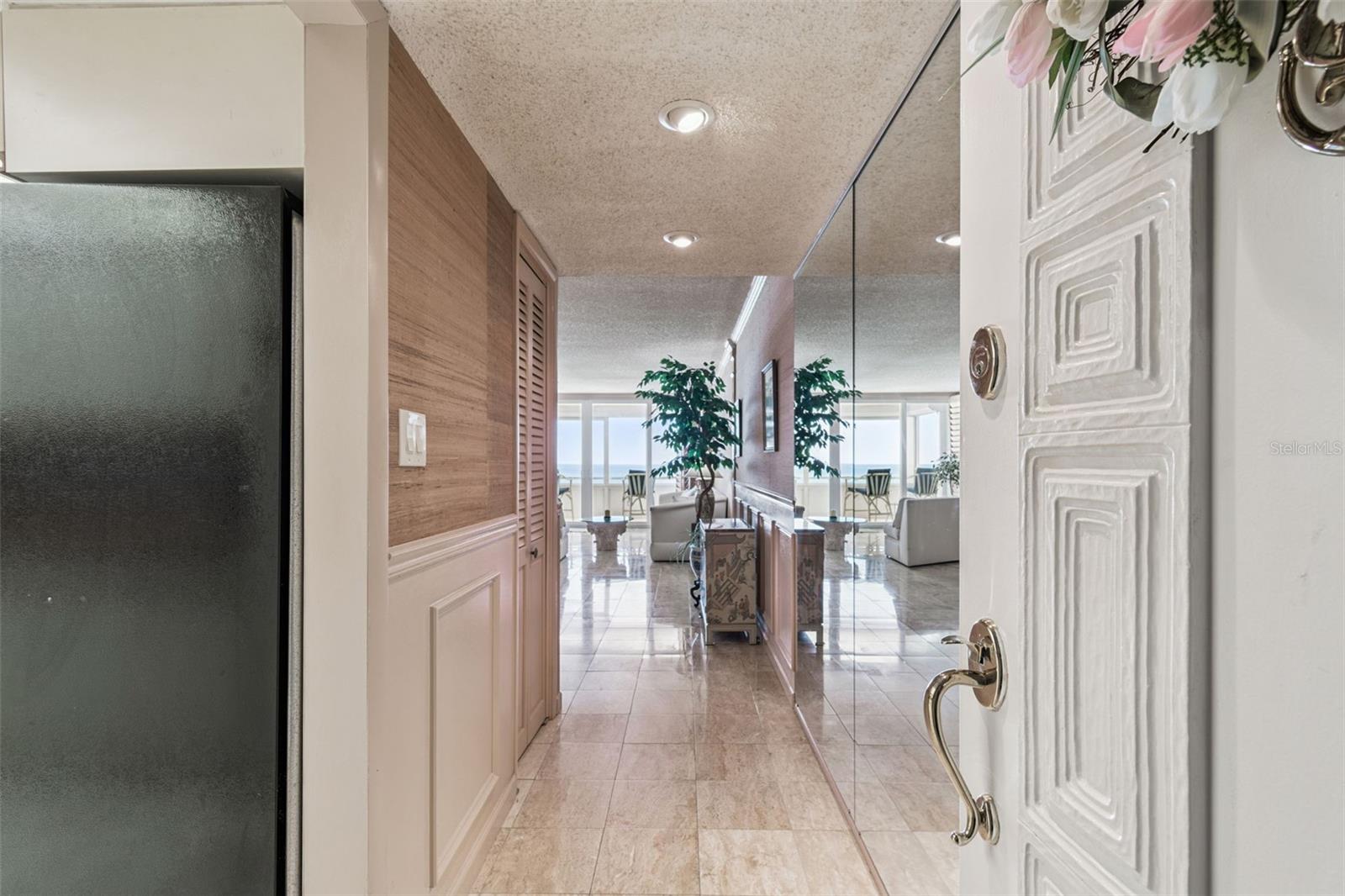Entryway with Kitchen on left and Living Area ahead