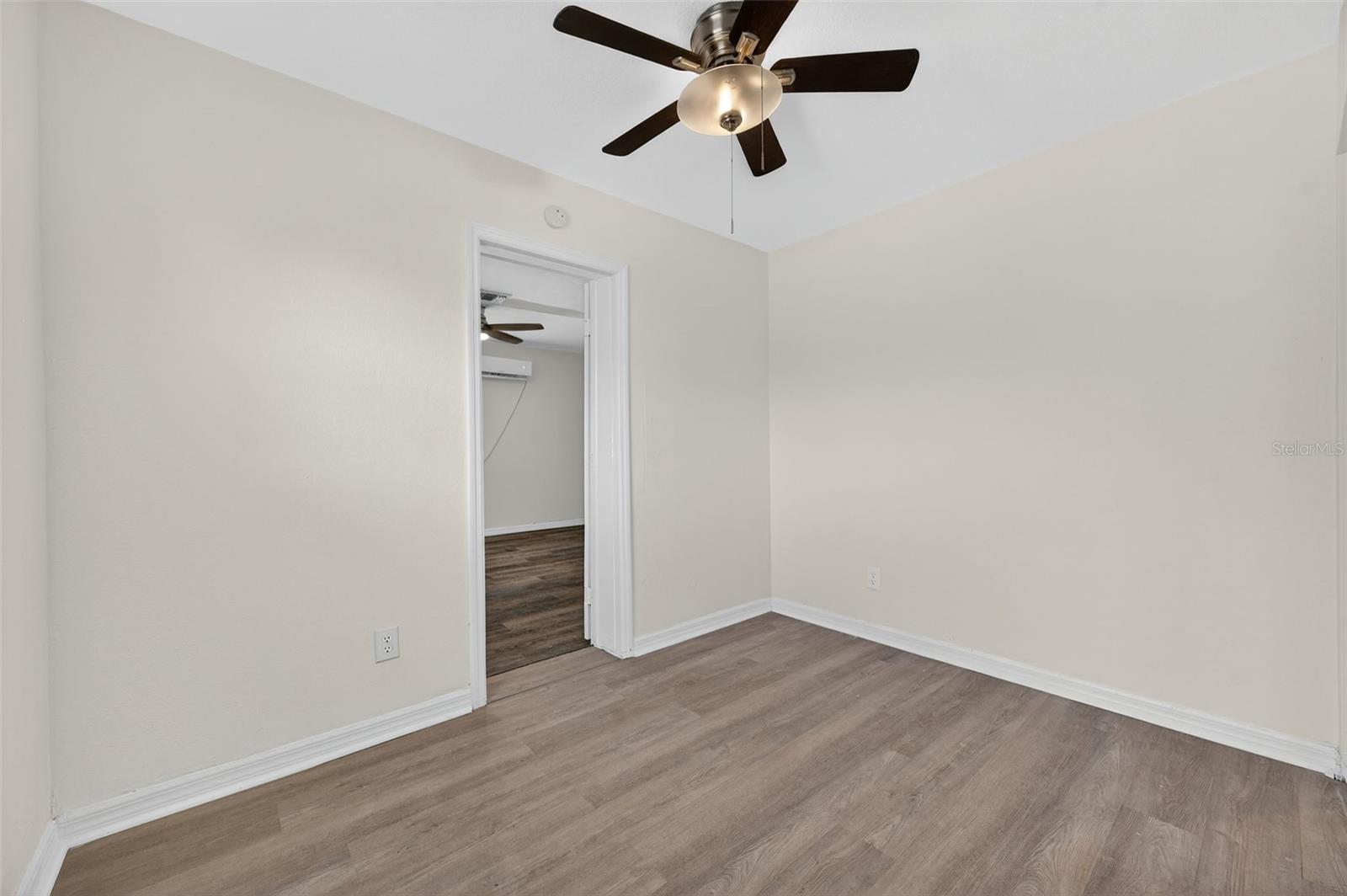 Bedroom 2 - Can be accessed through the Primary Suite or the hallway. Great for a nursery or home office.