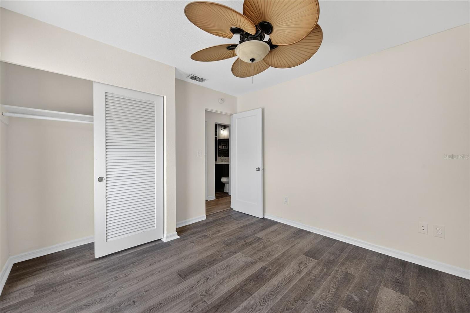 Bedroom 3 with access to the backyard and swimming pool