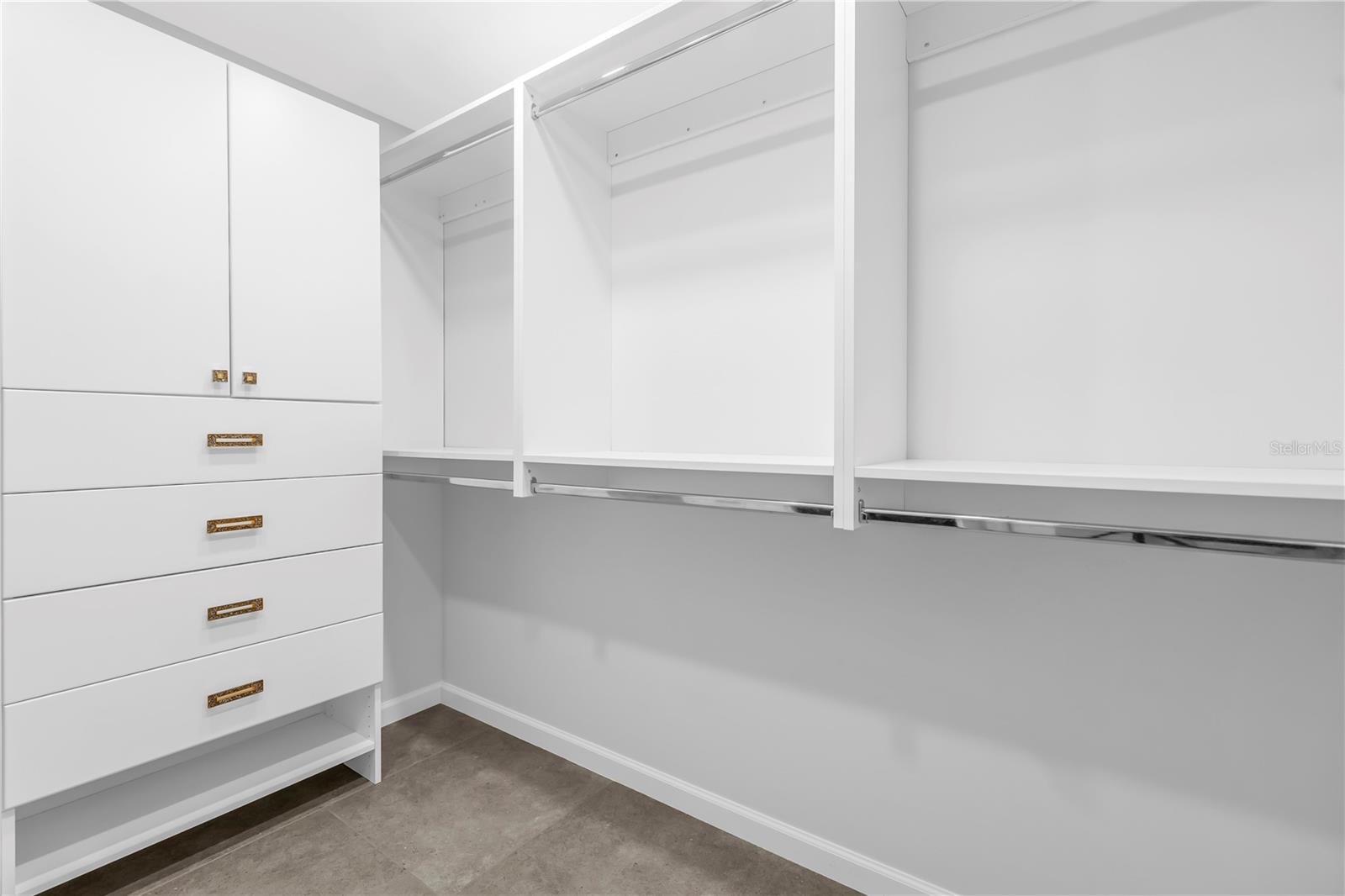 Primary bedroom walk-in closet