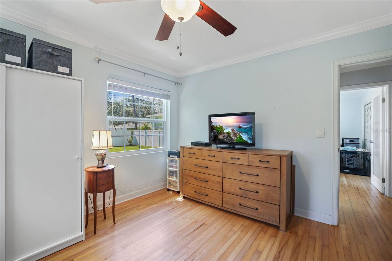 Bedroom 2 with original hardwood floors