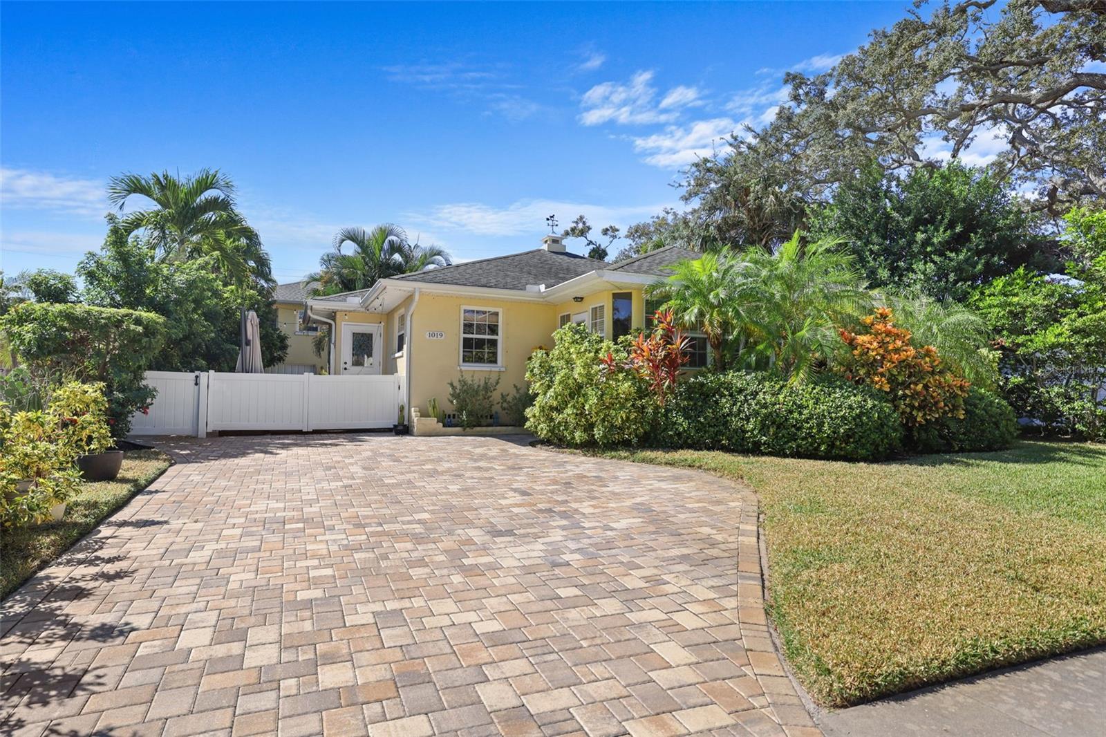 Paver Driveway and patio beyond the fence