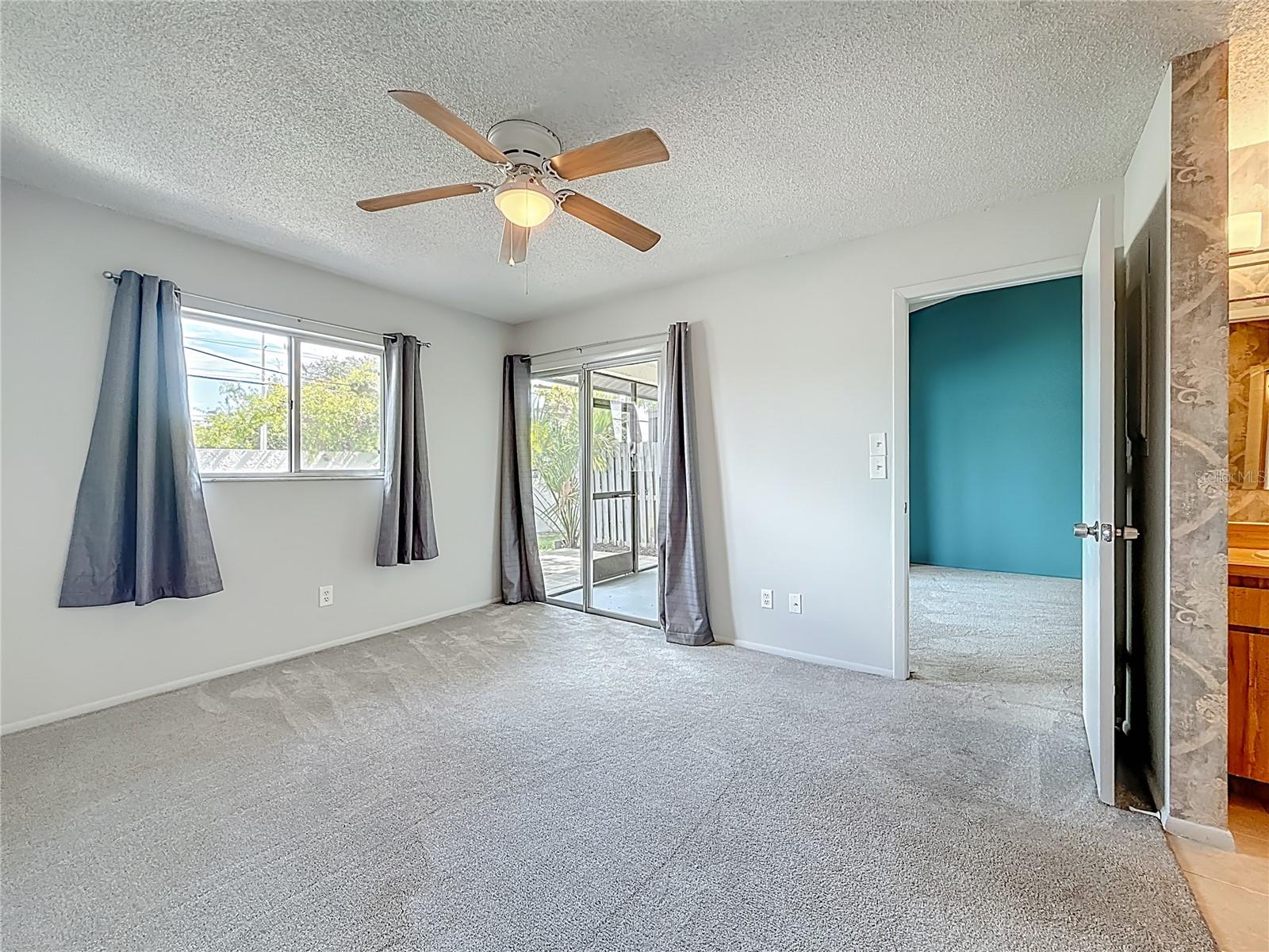 Primary Suite - Sliding Doors to Patio
