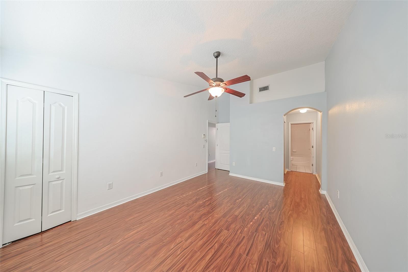 Plant shelf above entry to walk-in closet and bath
