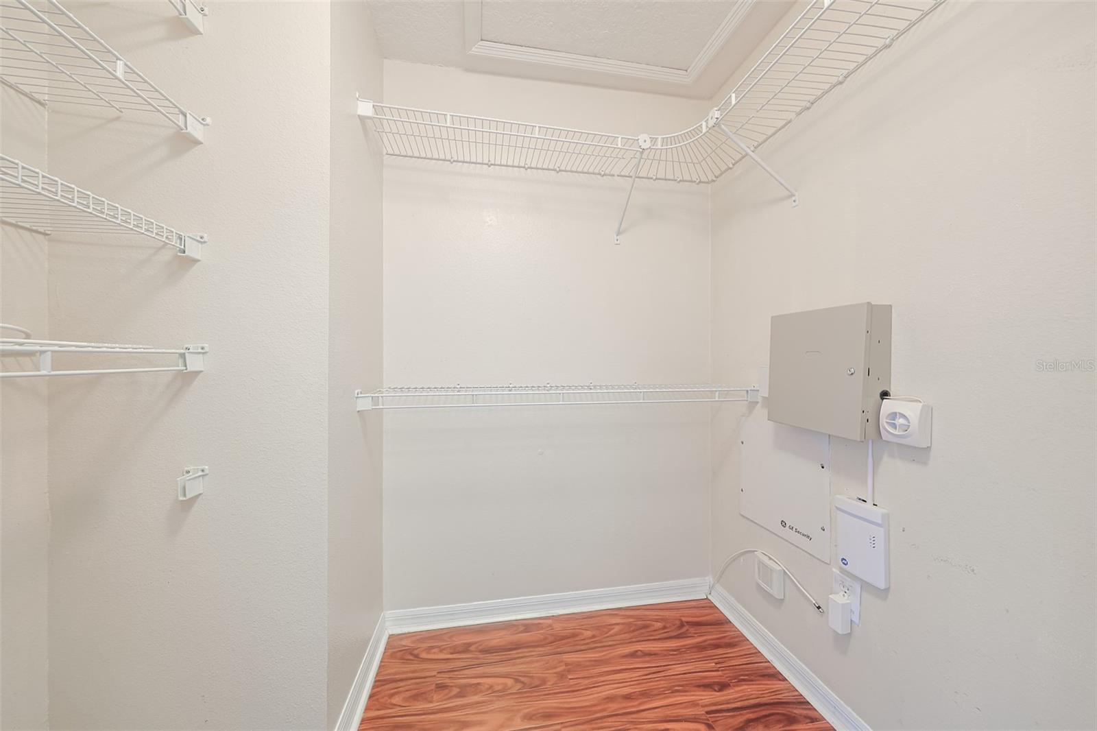 Large walk-in primary bedroom closet (one of two)