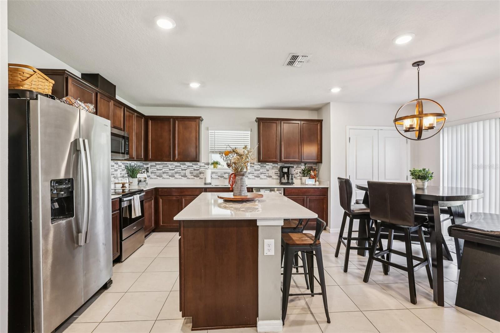 Large Kitchen with Stone Counters and Island