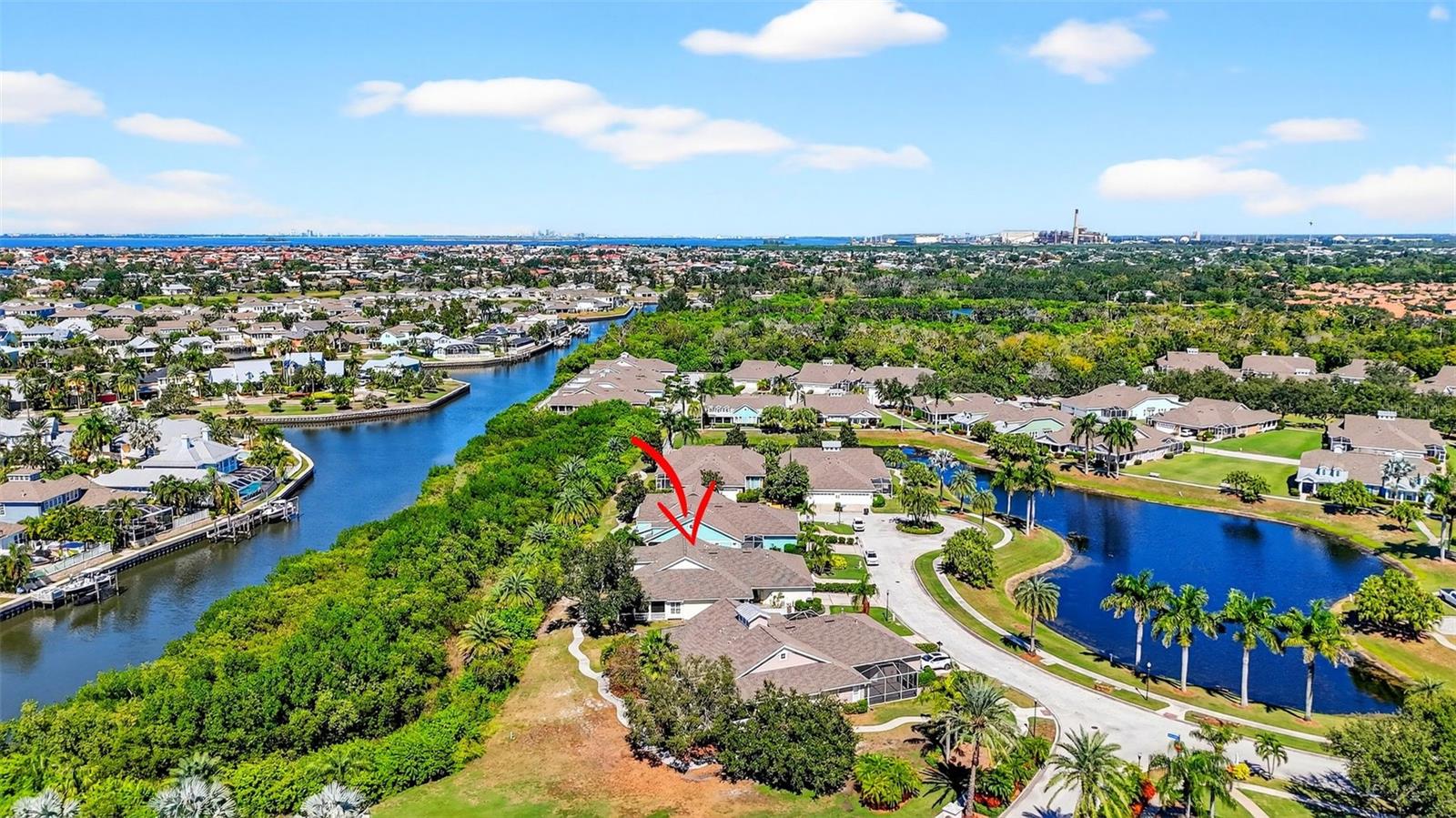 5610 Golden Isles Dr shown here with Canal at the front of Villa and Pond at the back of Villa.