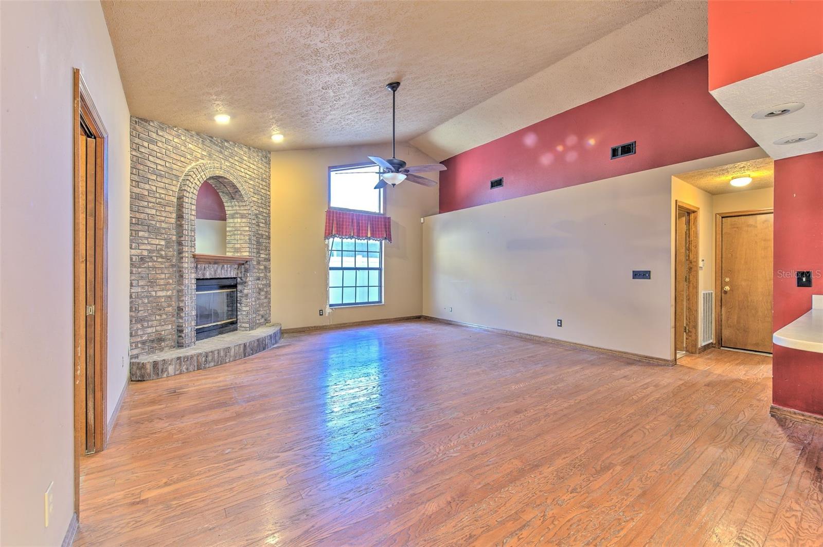 FAMILY ROOM WITH WOOD BURNING FIREPLACE