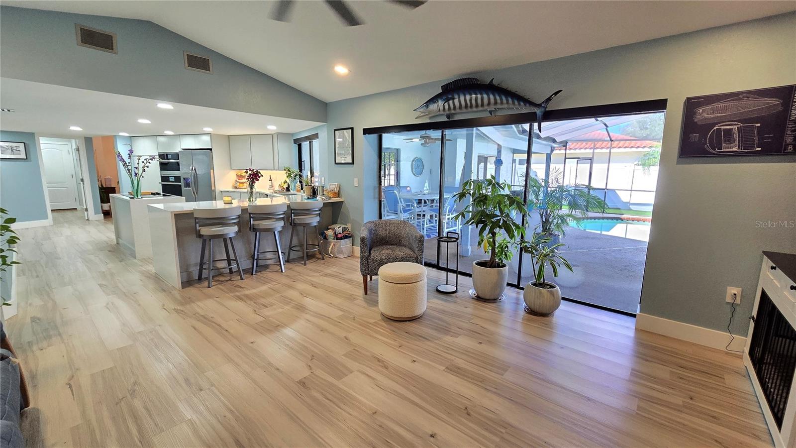 Family Room Kitchen combo area with lovely views of the back yard through the fully sliding doors.