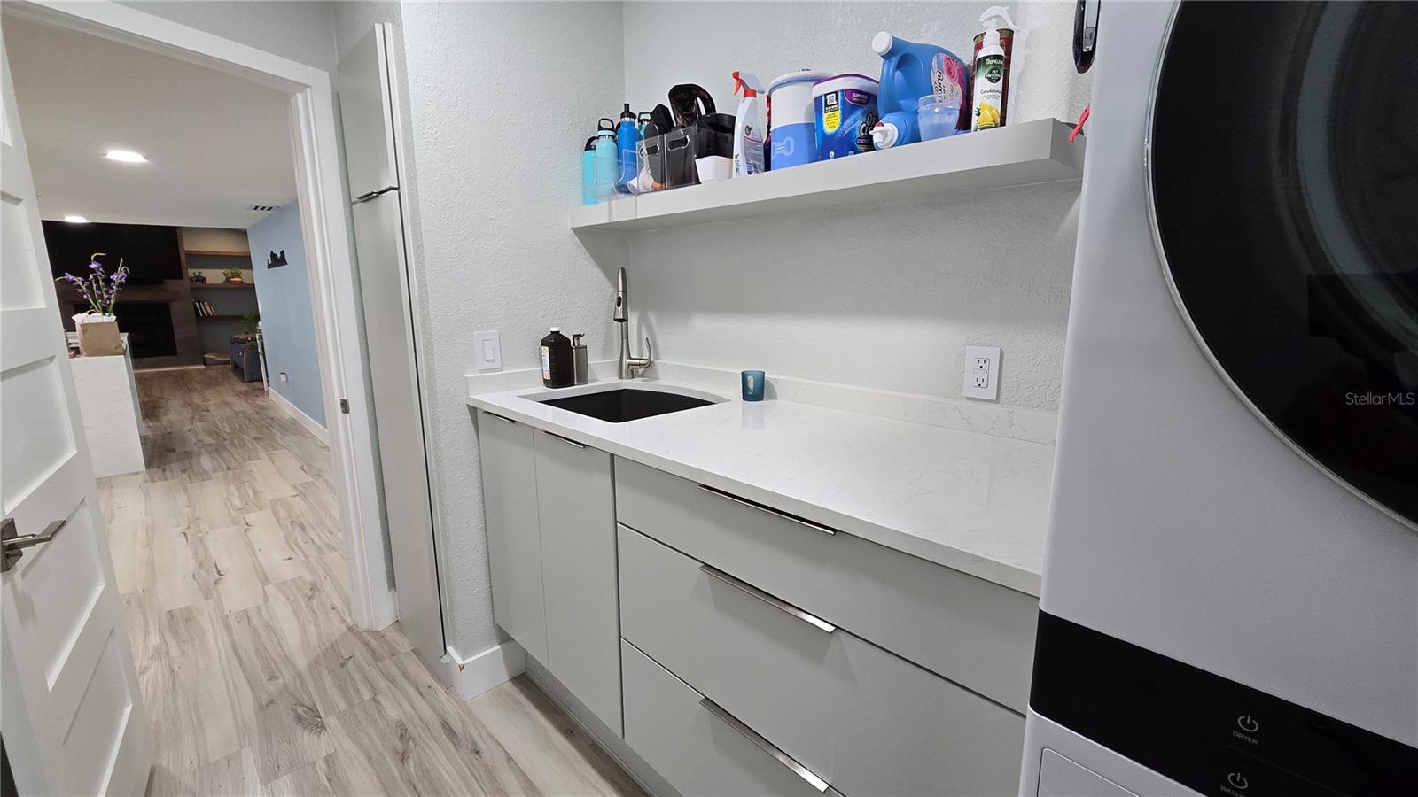 View of the laundry room coming in from the attached garage.