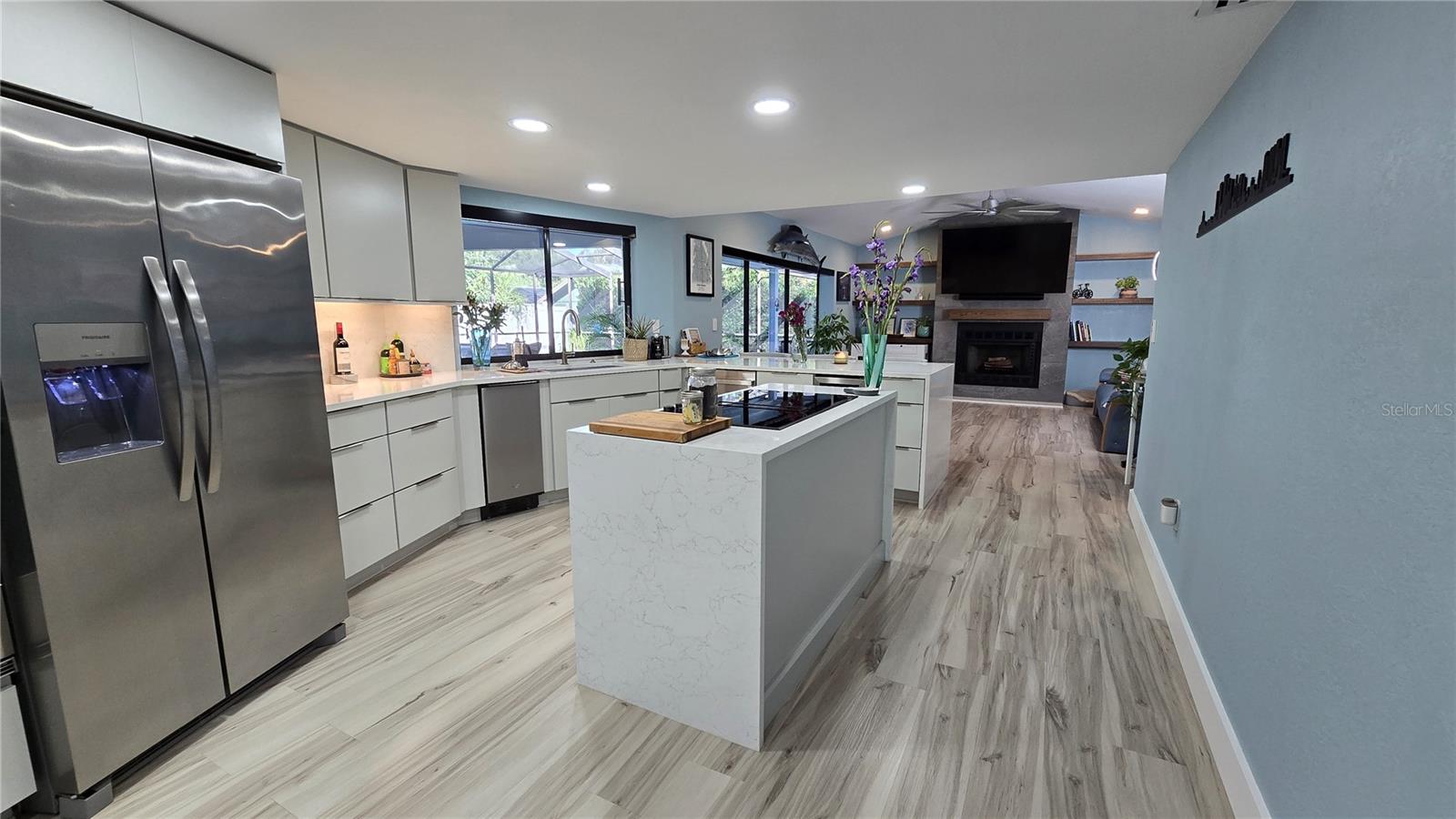 For all of you foodies that love cooking this is your place.  This newly remodeled kitchen has loads of cabinets with many slide out drawers, waterfall center island with a Jenn-Air cook top.  Also has top of the line appliances as well as a separate ice maker and a wine refrigerator just to mention a few.