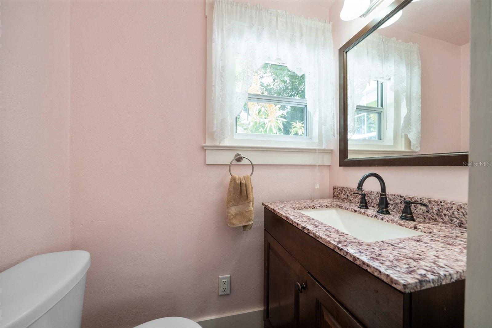 Half bathroom with updated vanity
