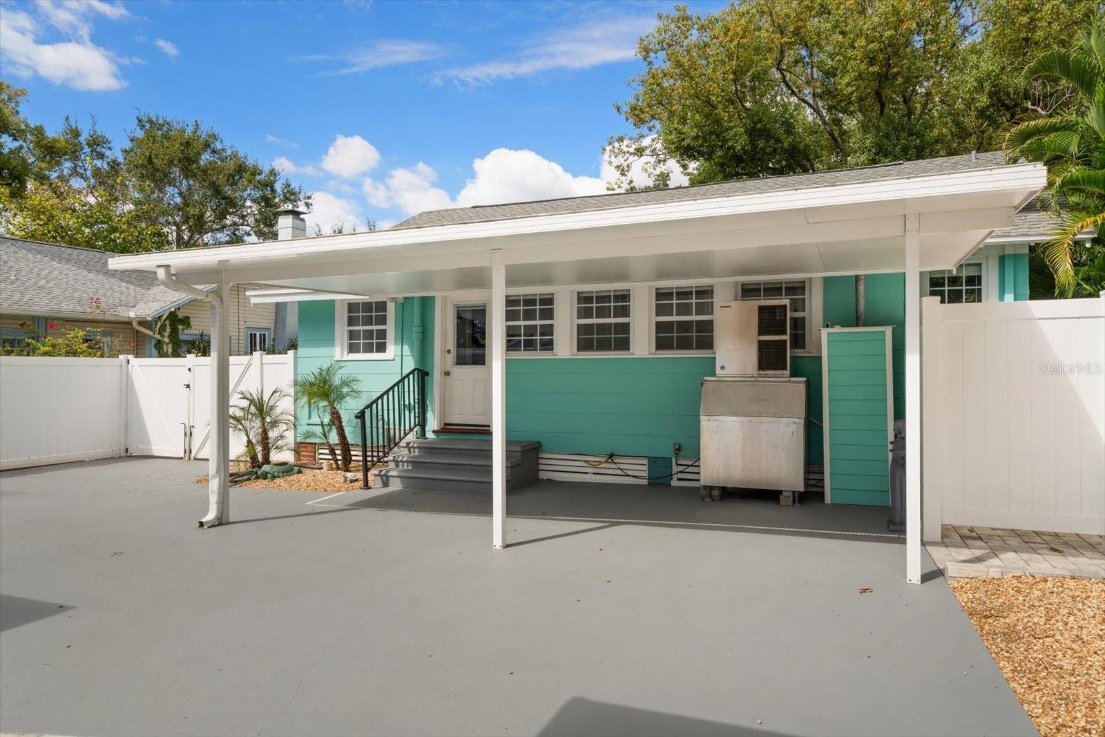 Exterior of back of home with covered patio