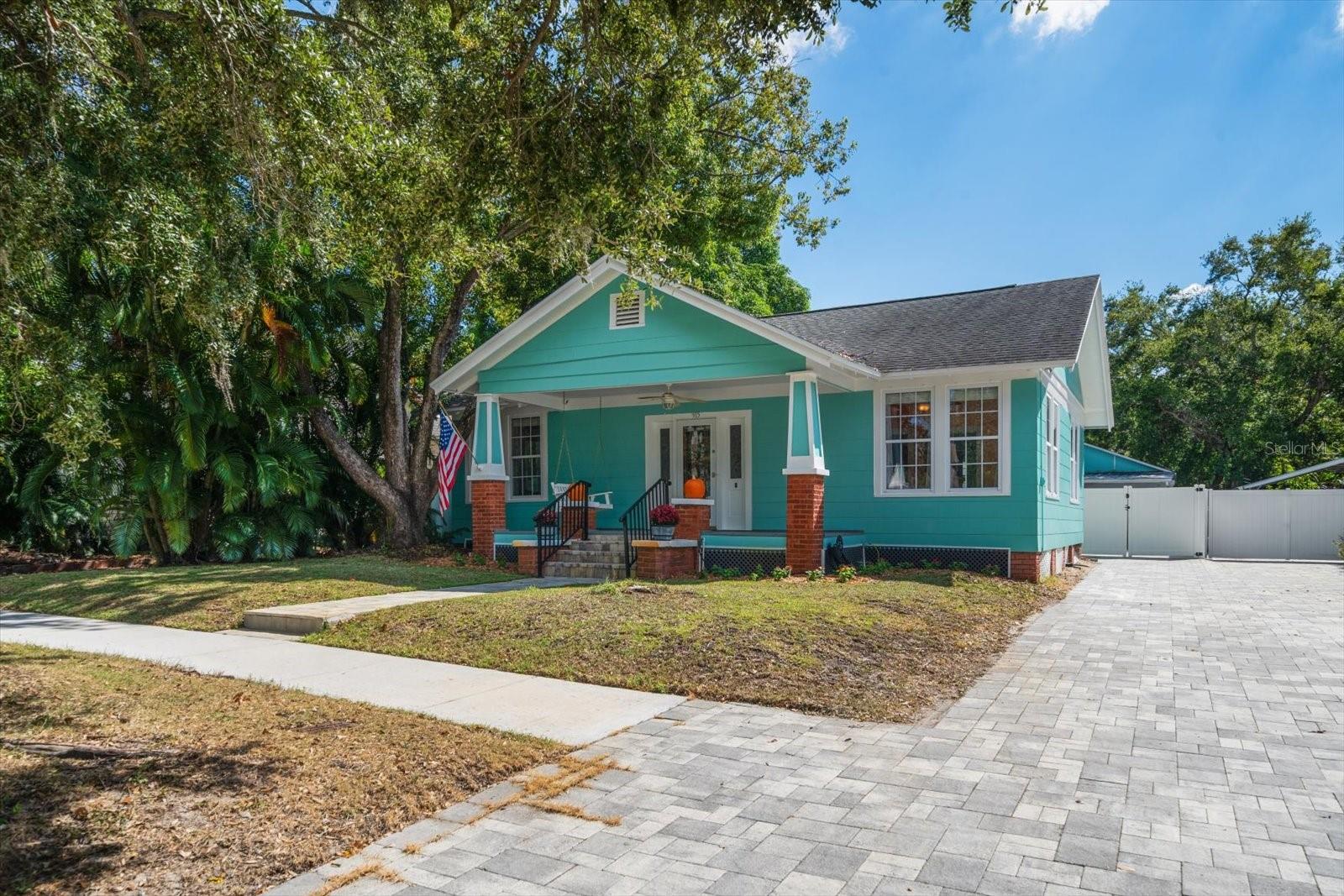 Front of home with pavered driveway
