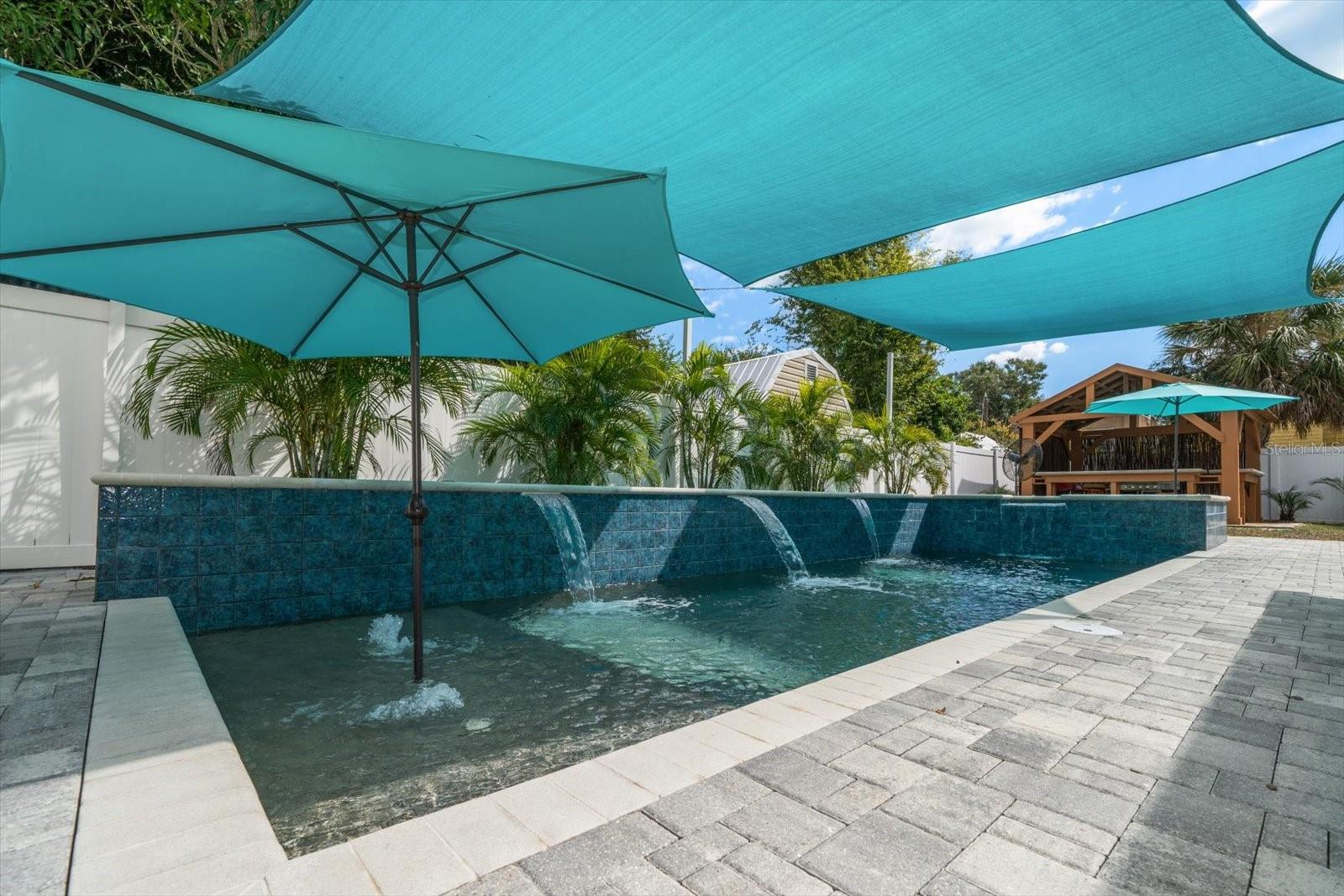 Cascading waterfall on side of pool