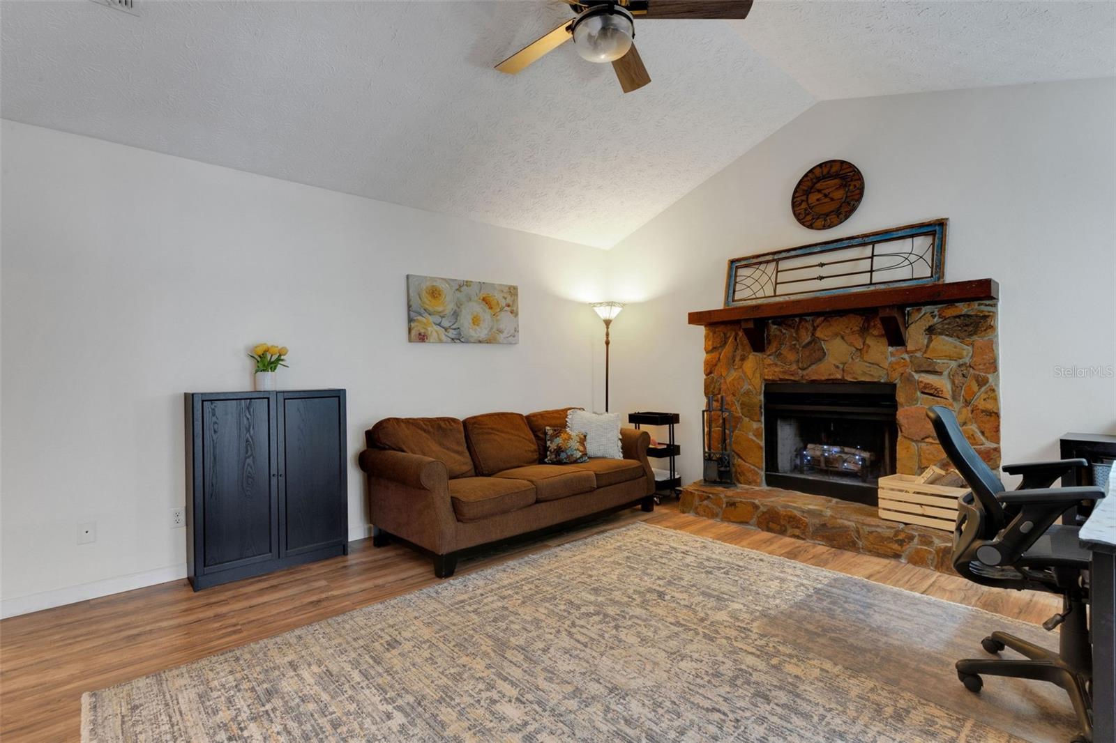 Family room with wood burning fireplace