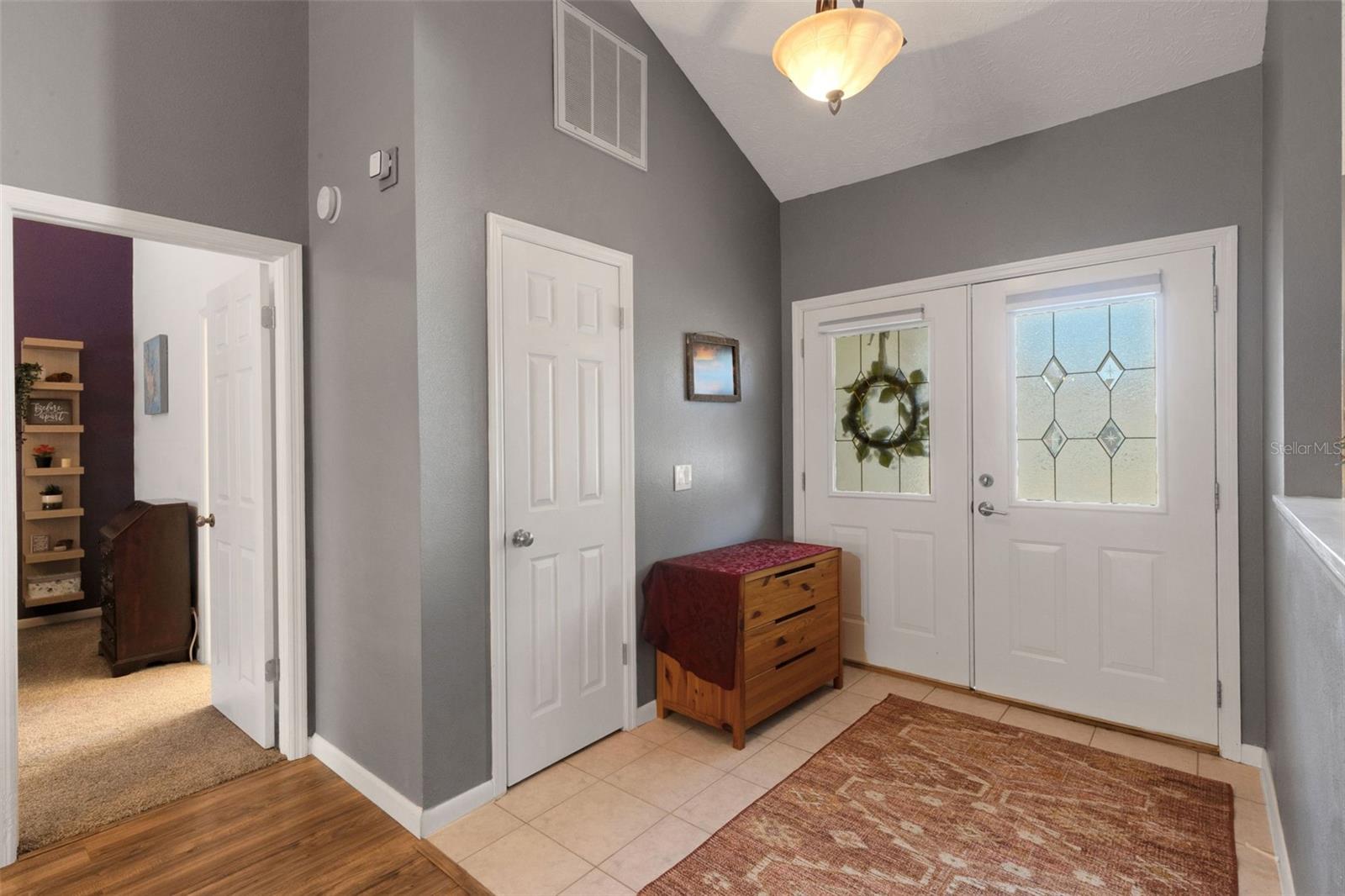 Welcoming foyer with coat closet