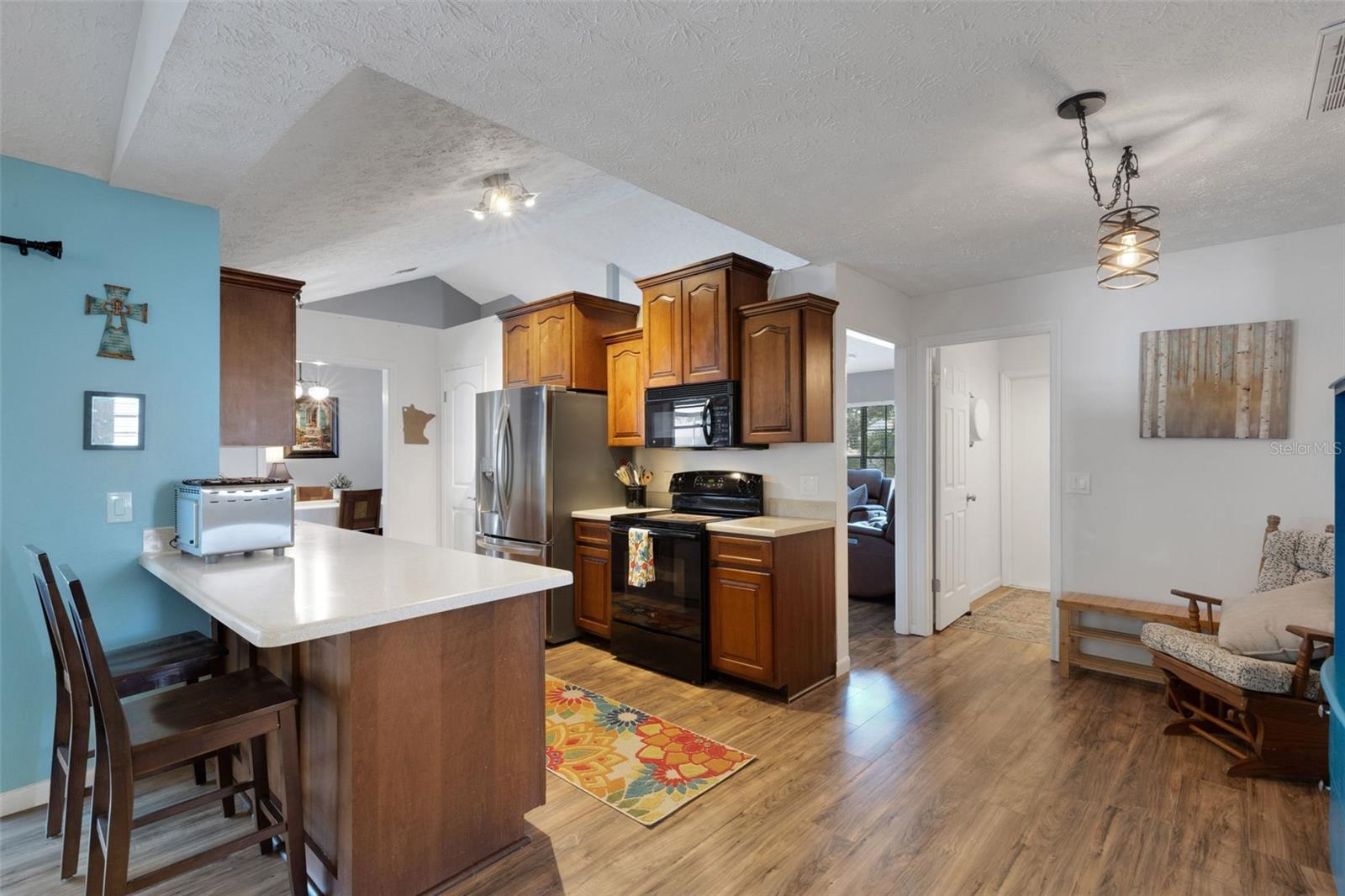 Wood cabinetry, snack bar and breakfast nook
