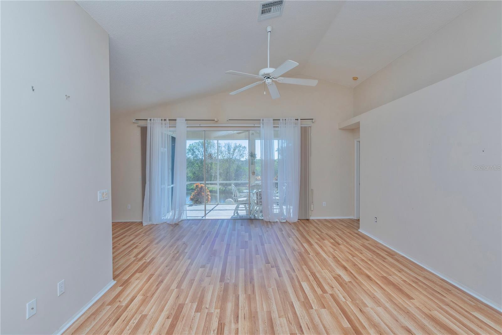 Living room view to screen porch.