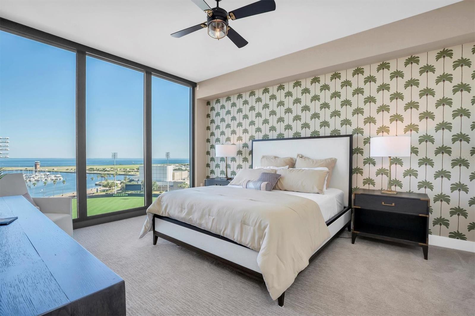 Primary ensuite with views to Tampa Bay with custom room darkening shades