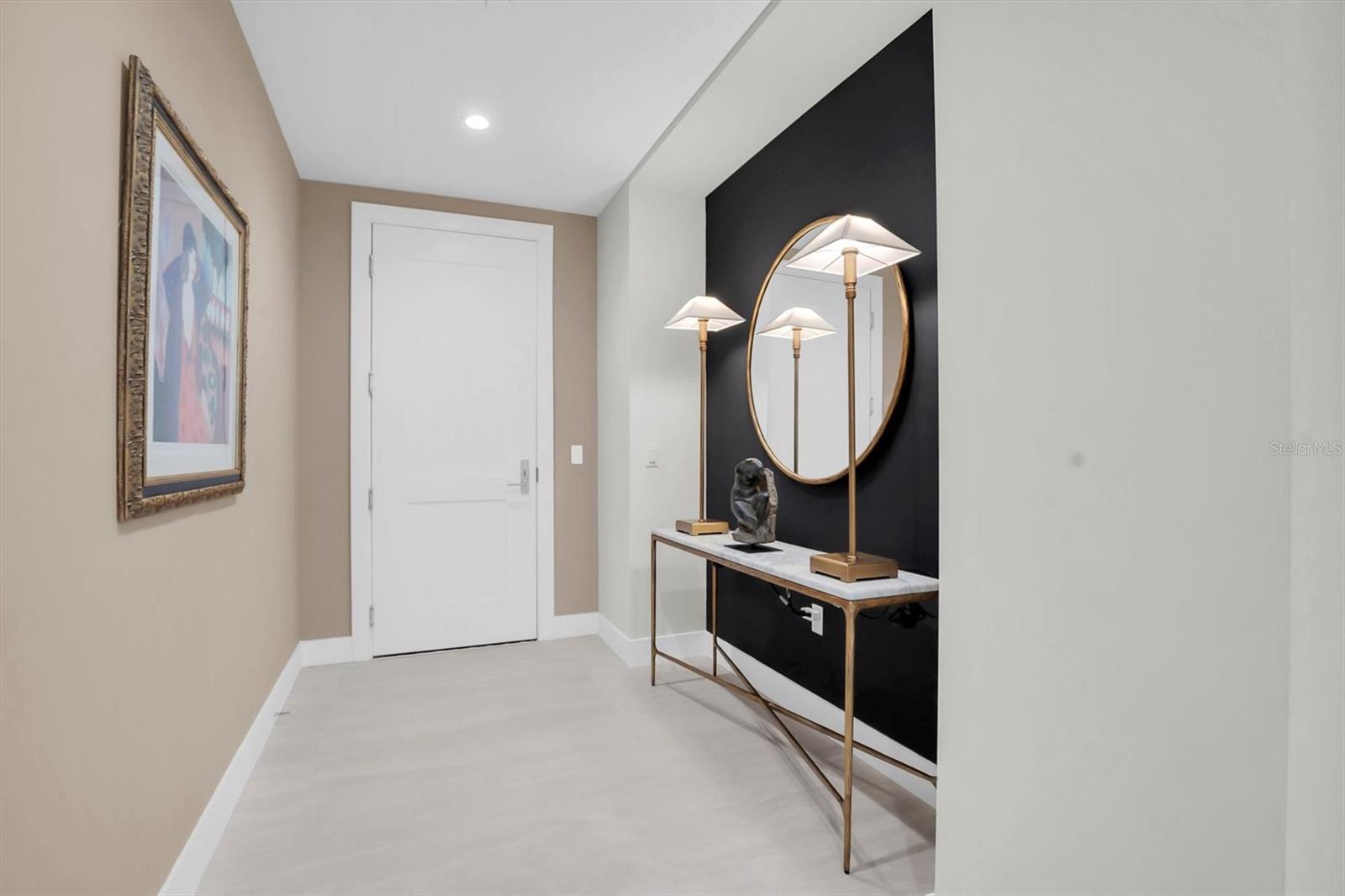 Elegant foyer featuring interior designed accent walls