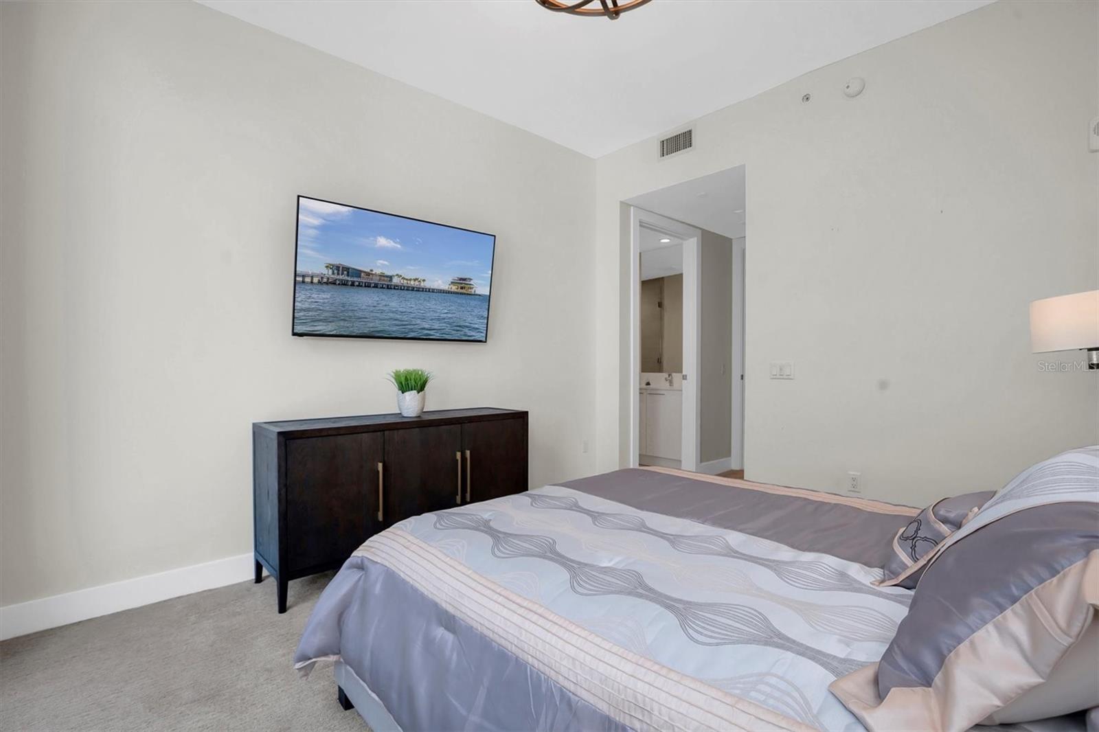 The 3rd bedroom features a private ensuite and a flat-screen TV