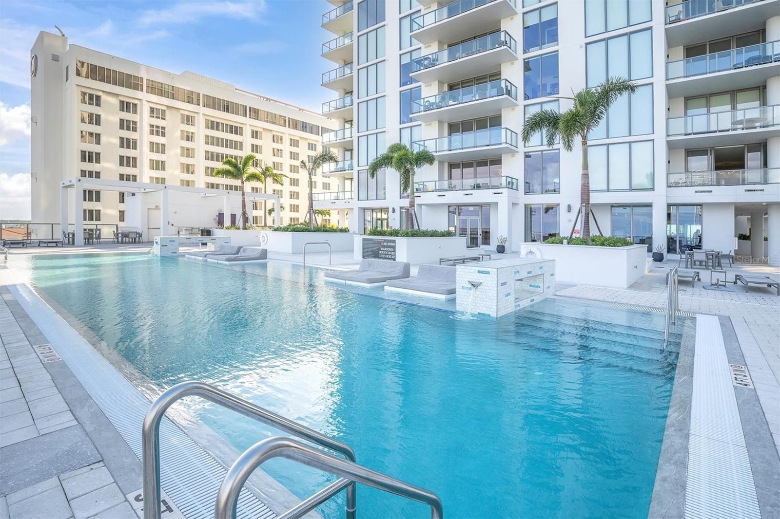 Resort-style poolside beds offer the perfect spot to relax and take in the beautiful Tampa Bay views