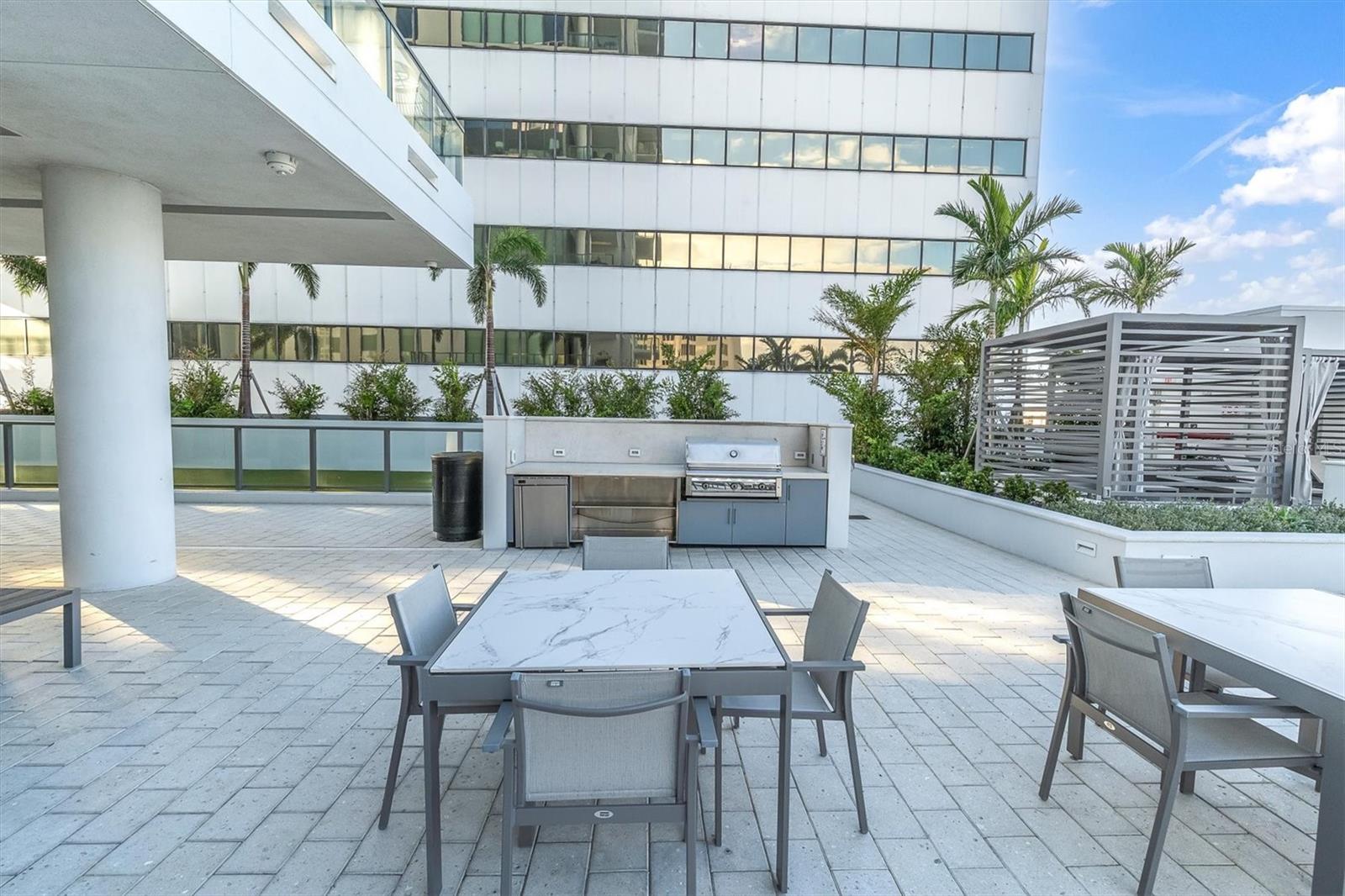 Grilling station with ample tables designed to make entertaining effortless.