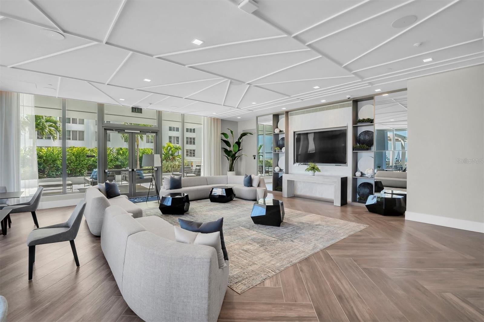 Elegantly appointed social room on the 7th floor featuring a large-screen TV, perfect for watching your favorite sports or movies