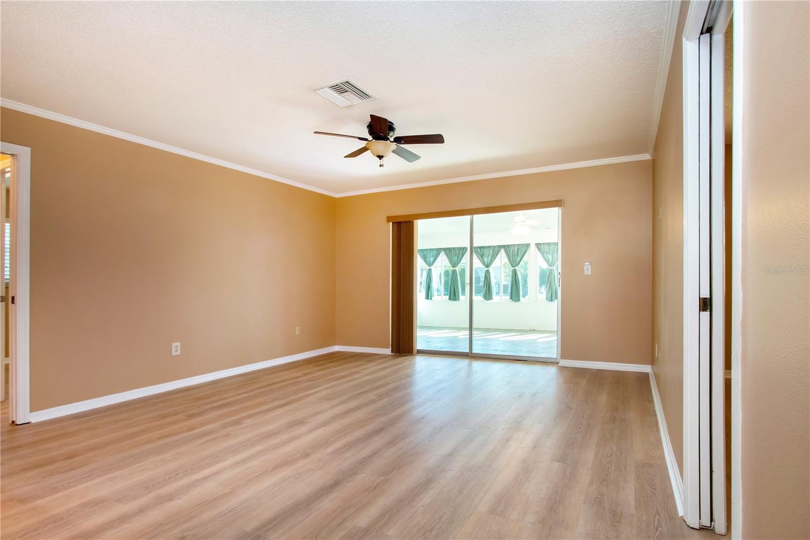 FAMILY ROOM/SLIDERS TO FLORIDA ROOM