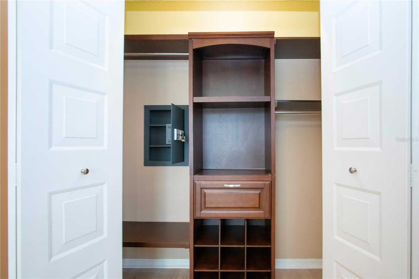 BEDROOM 2 CLOSET WITH BUILT-IN AND SAFE