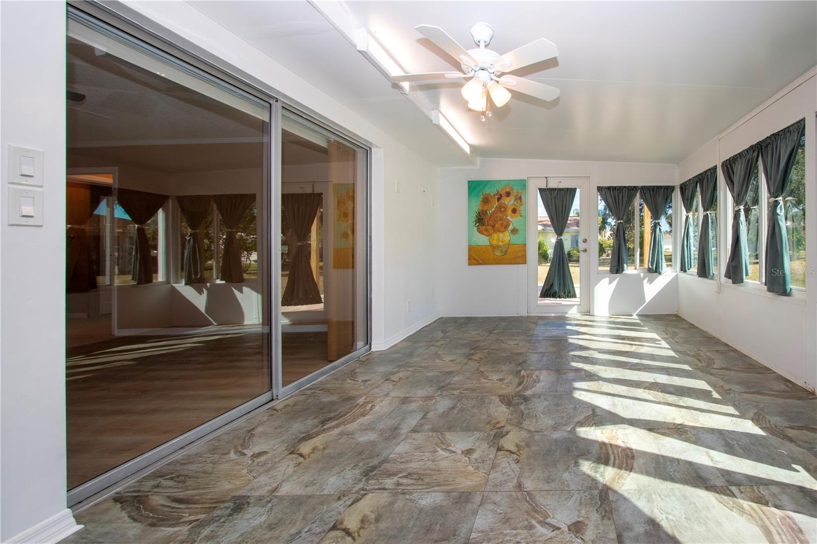 SLIDERS TO THE FAMILY ROOM/ ACCESS DOOR TO PATIO