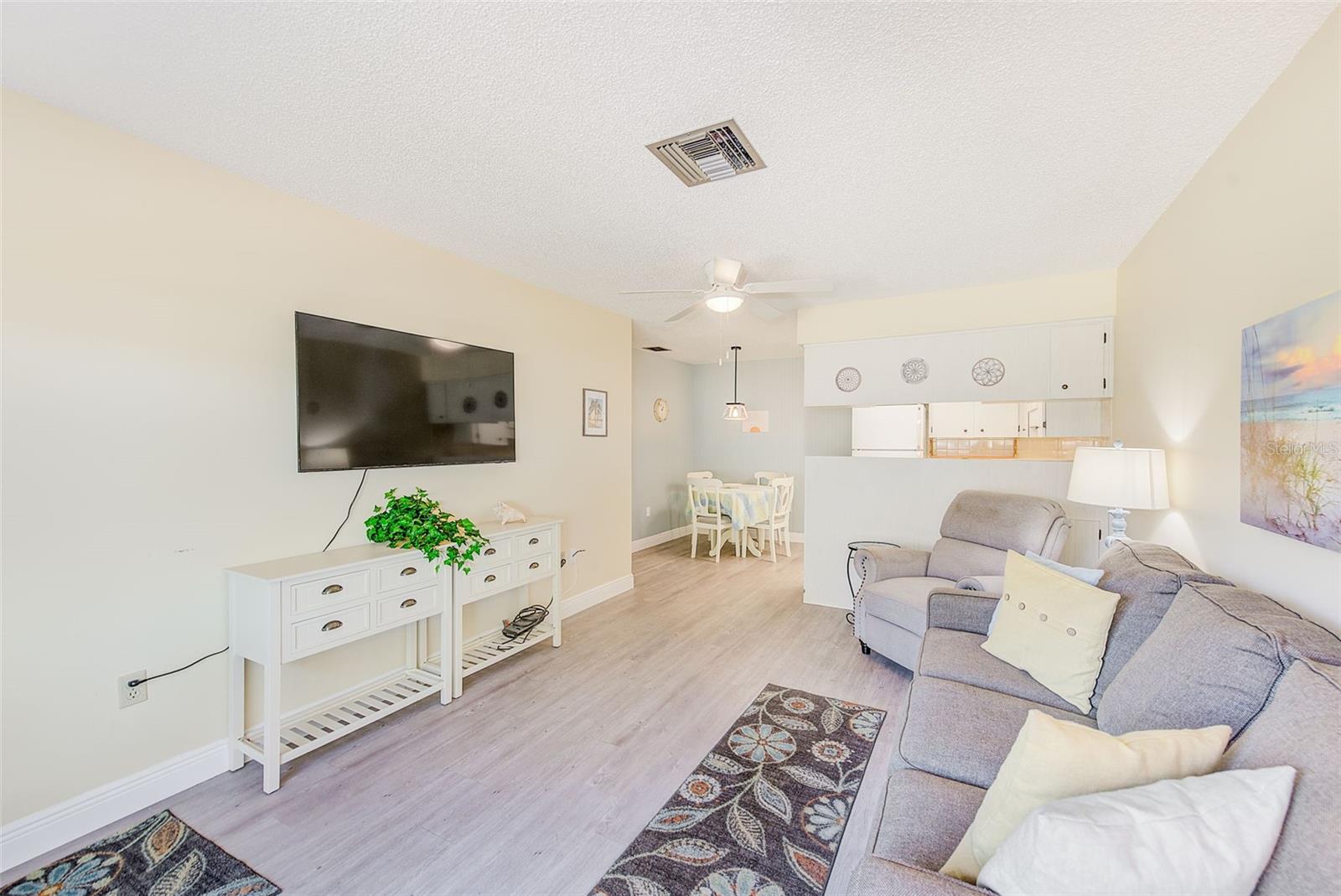 Open floor plan with living room dining area and kitchen