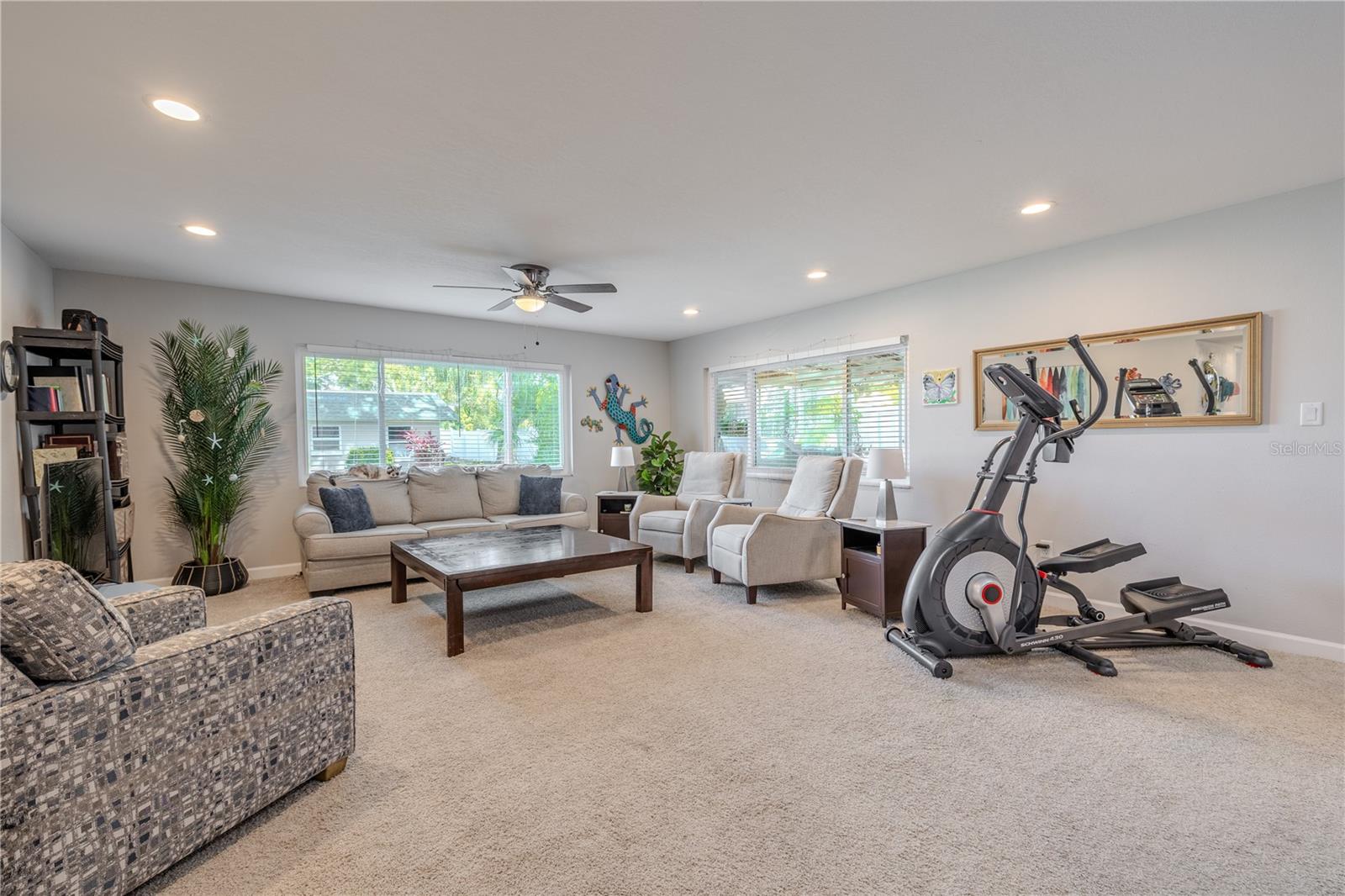 The living room is the true heart of the home, blending warmth and comfort with a sense of openness. Large windows fill the space with natural light, while the layout encourages easy conversation and connection.