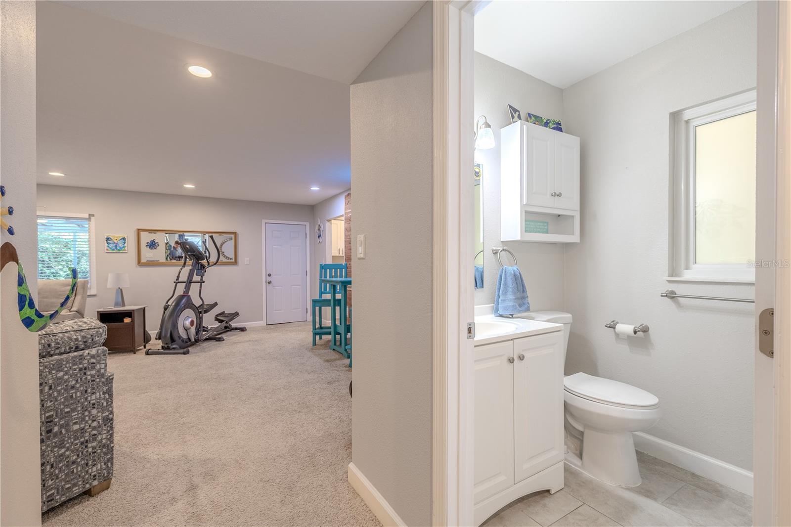 Beautifully updated full guest bath featuring modern tile, a sleek vanity, and a tub-shower combination. Perfectly positioned for visitors or as a shared bath for the second bedroom.