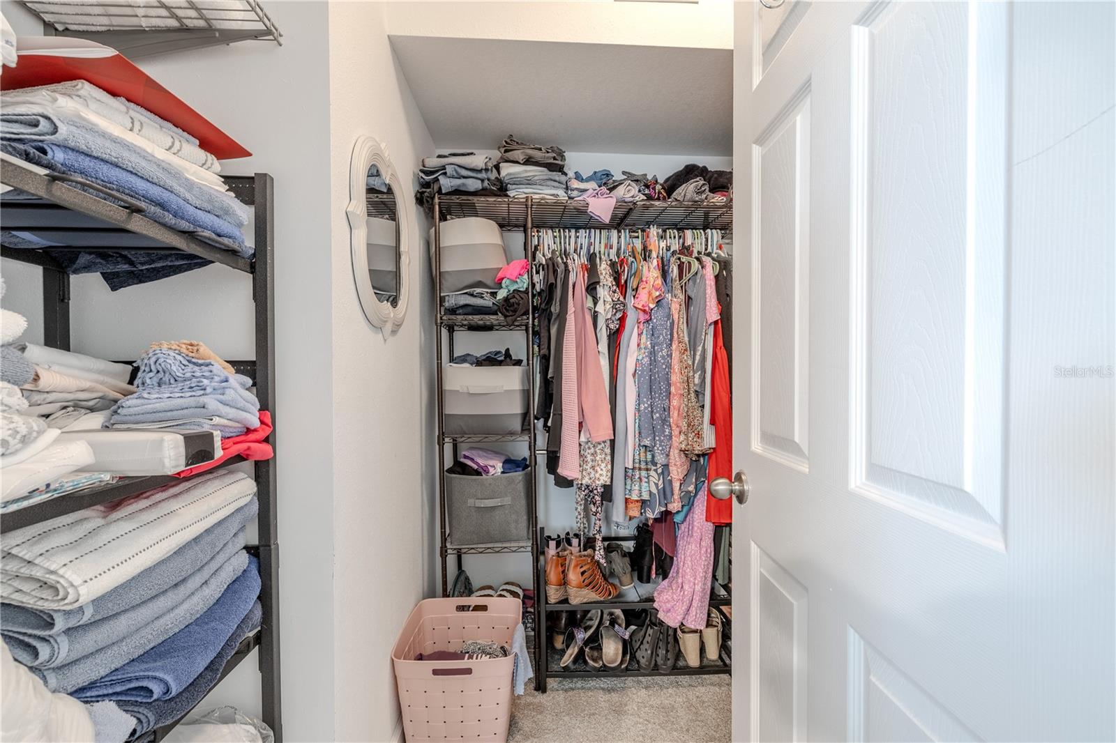 Generous walk-in closet offering excellent storage and organization potential, with plenty of space for both seasonal and everyday wear.