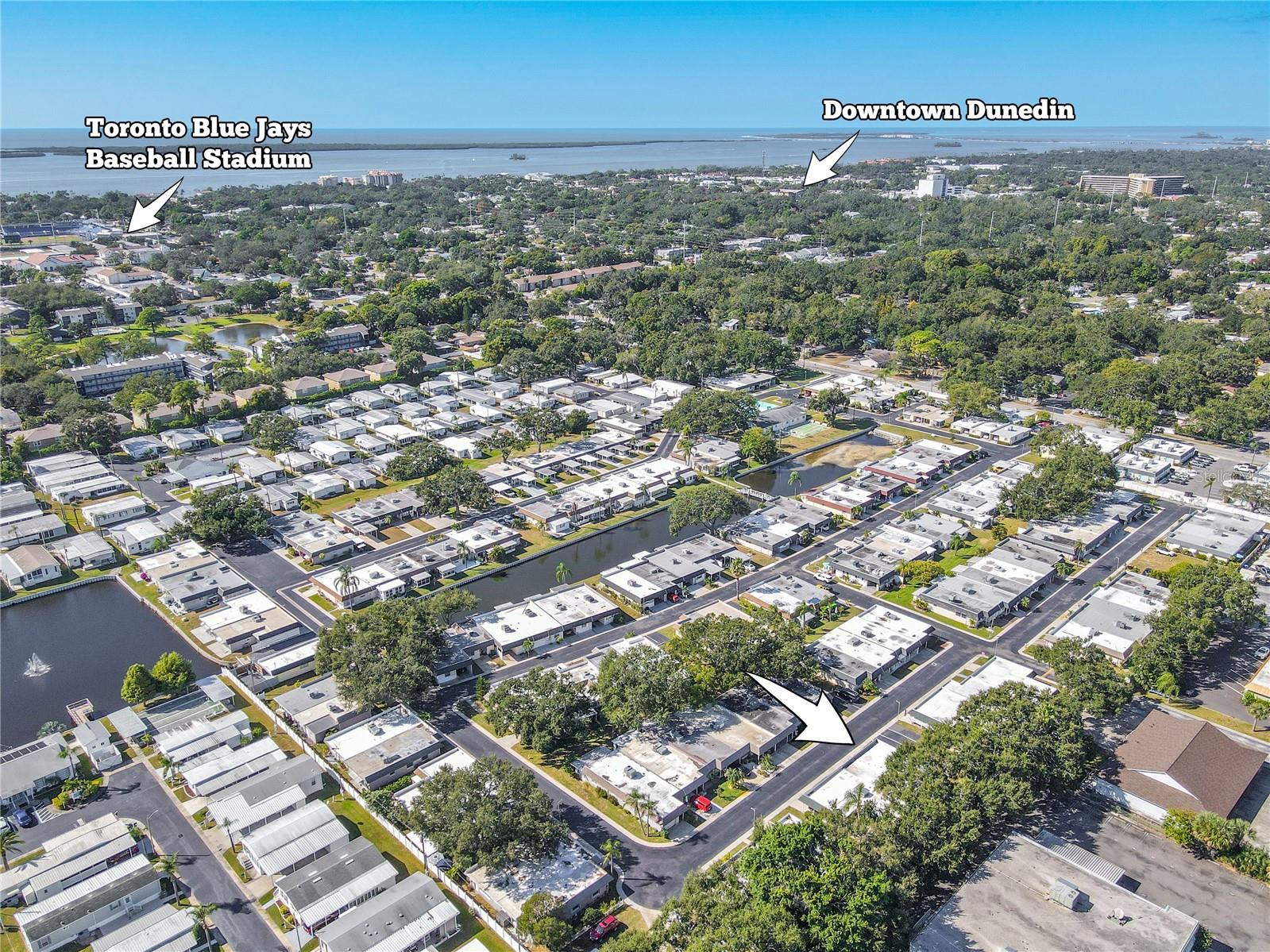 Aerial perspective showcasing the community layout and proximity to downtown Dunedin, the Pinellas Trail, and the nearby amenities.