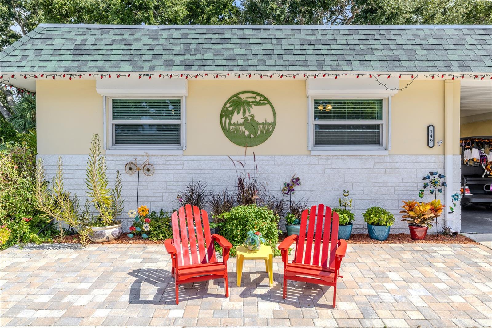 A charming touch at the front entry, perfect for a pair of chairs or a small table to enjoy morning coffee or an evening chat with neighbors.