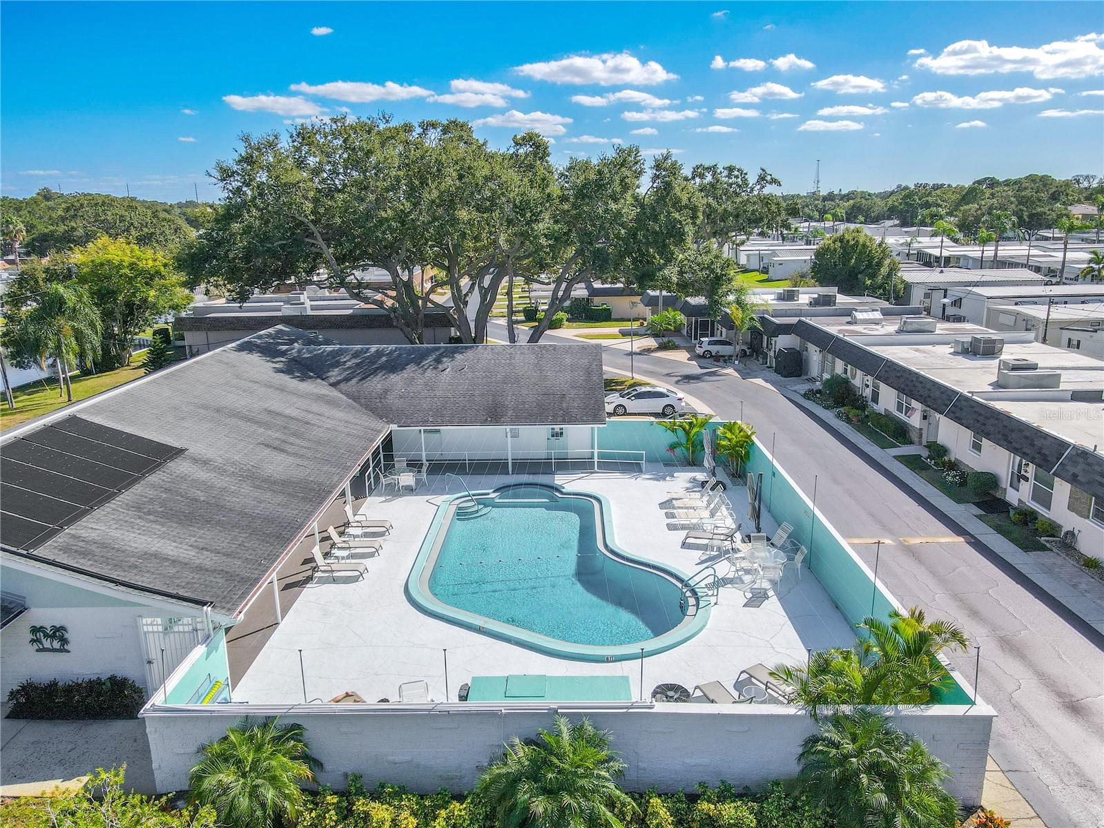 An inviting view of the community clubhouse and sparkling pool, the heart of Skye Loch Villas. Perfect for cooling off, socializing, or simply soaking up the Florida sunshine.